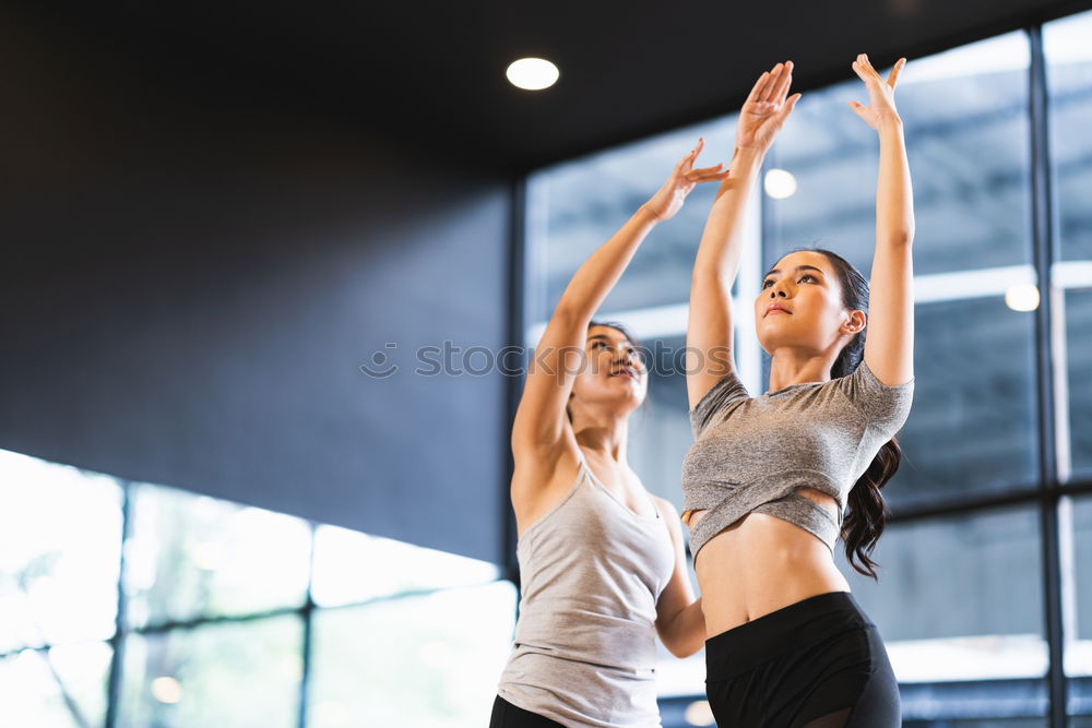 Similar – Image, Stock Photo Women doing stretch exercises in fitness class
