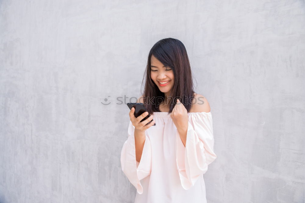 Similar – young woman with phone outdoors