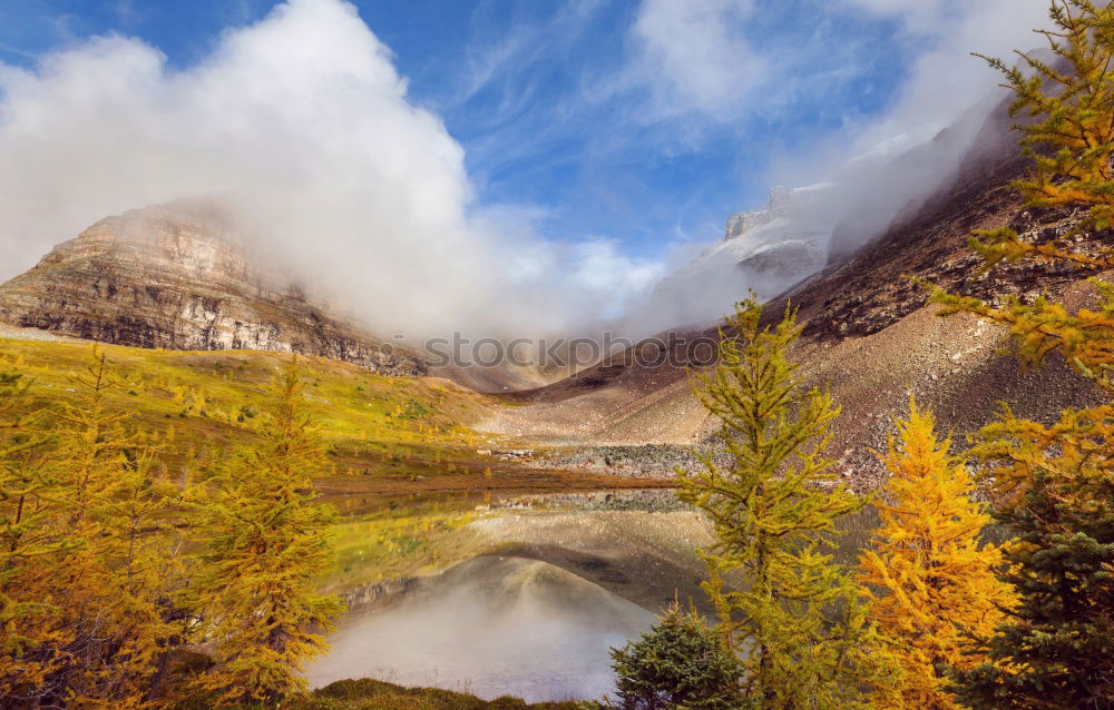 Similar – Snow-capped mountains and frozen river