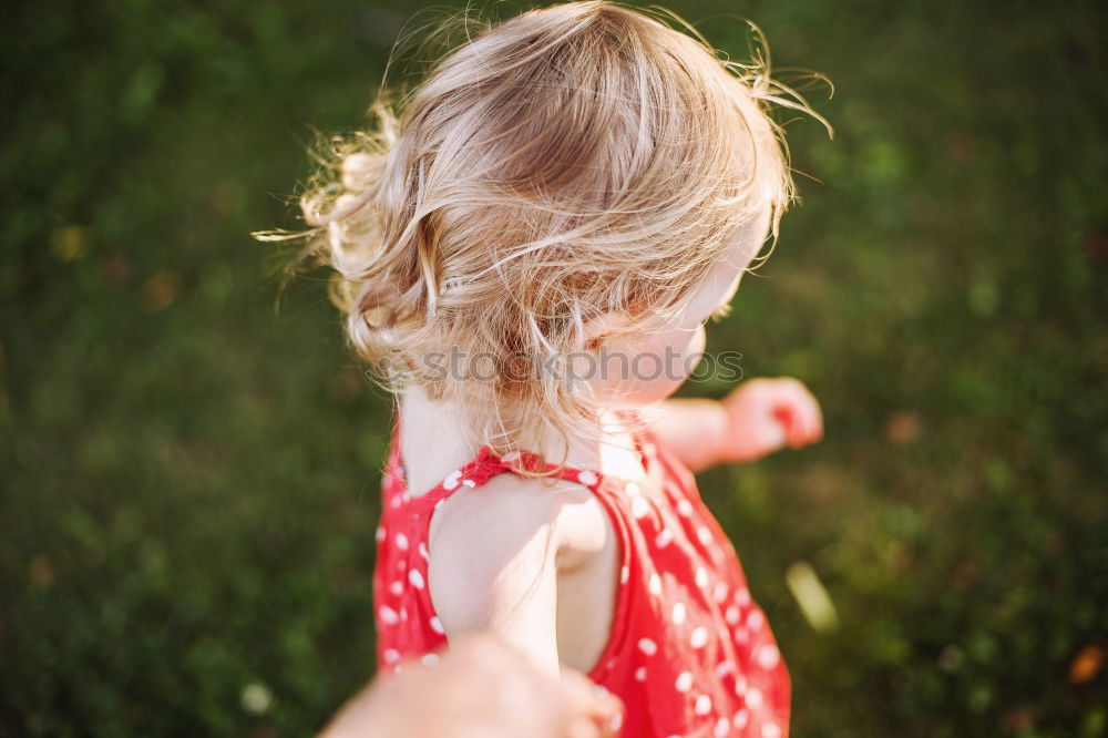 Similar – Sad mother and daughter sitting on bench in the park at the day time.