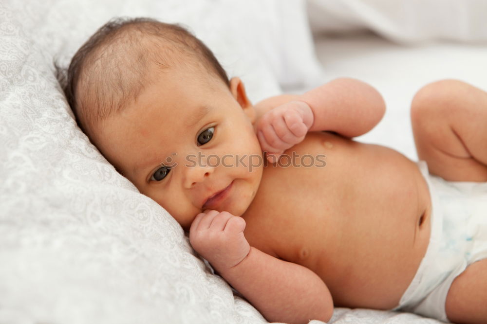 Similar – Portrait of a crawling baby on the bed in his room