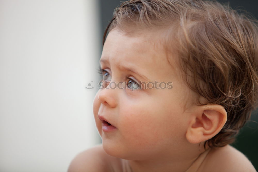 Similar – Baby looks in the mirror and discovers his reflection