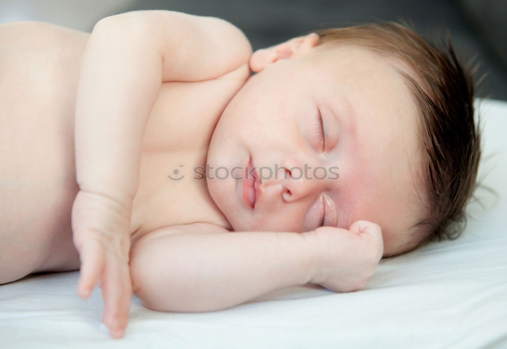 Similar – Baby sleeping on a blanket