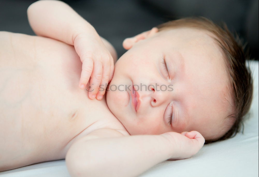 Similar – Baby sleeping on a blanket