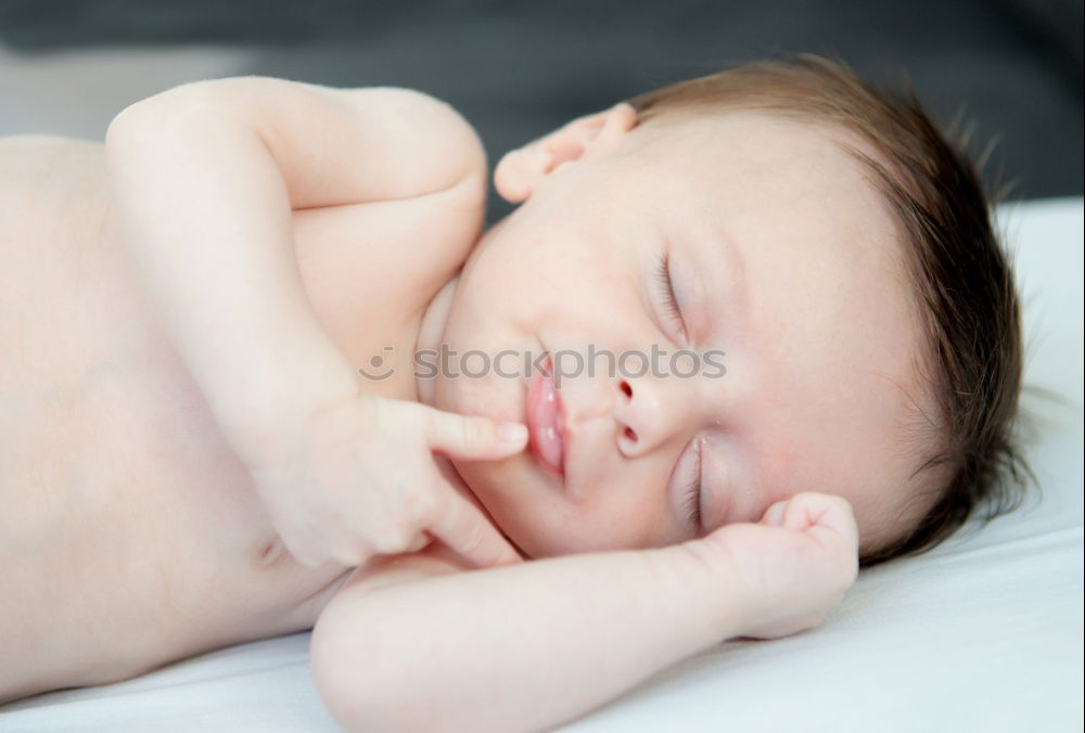 Similar – Baby sleeping on a blanket