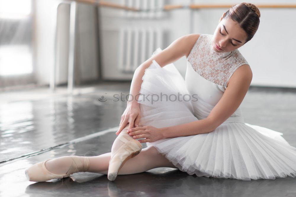 Similar – Elegante Ballerina in weißem Kleid tanzt gegen eine rustikale Wand