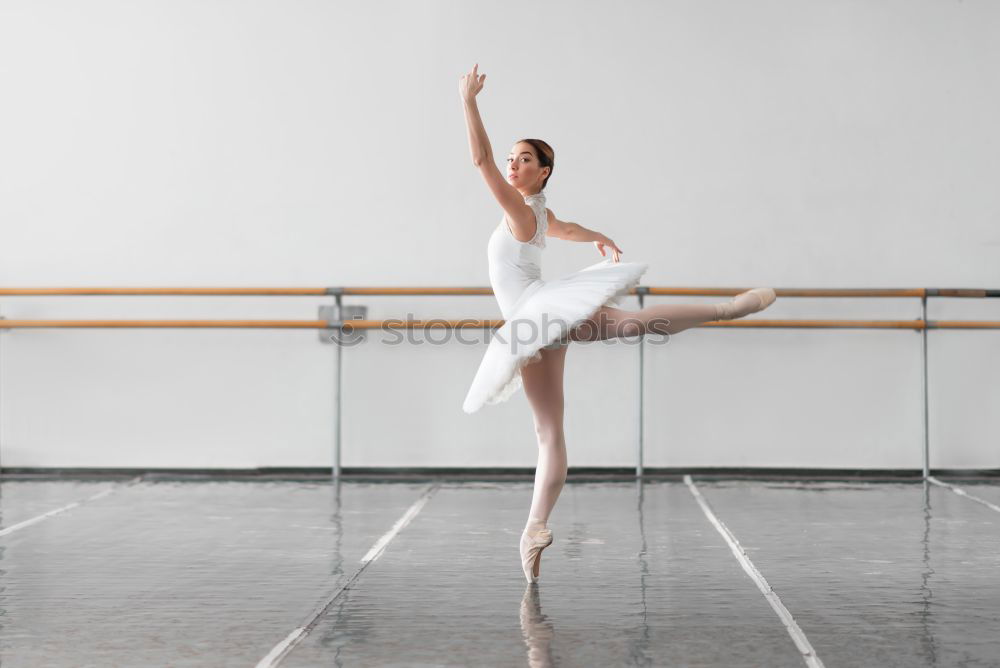 Similar – Elegante Ballerina in weißem Kleid tanzt gegen eine rustikale Wand