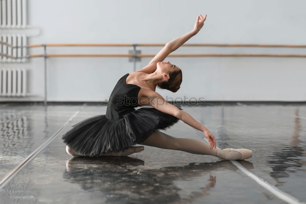 Similar – Top view at ballet dancer tying slippers around her ankle