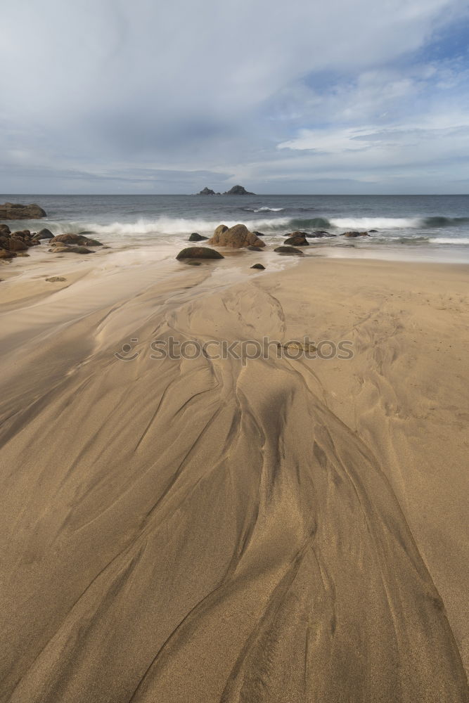 Similar – Sandy shore and mountains