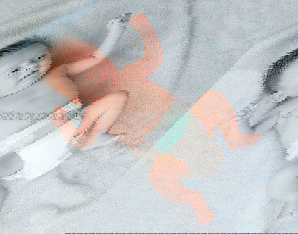 Similar – Image, Stock Photo Newborn baby resting lying above of travel suitcase