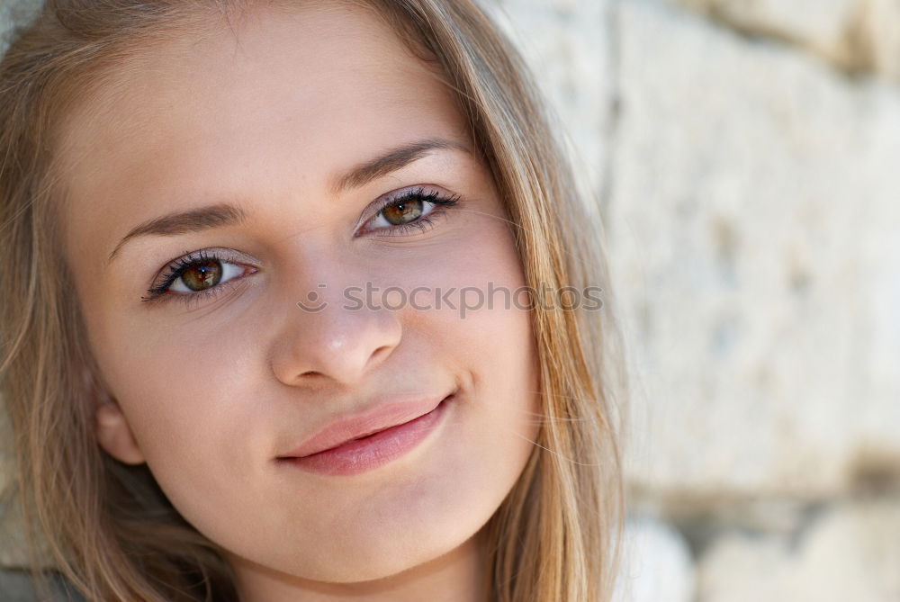 Similar – young woman in front of a wall with a climbing plant