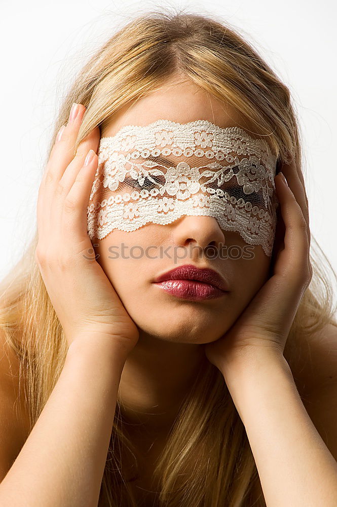 Similar – Young woman winking an eye with a bow tie in her mouth