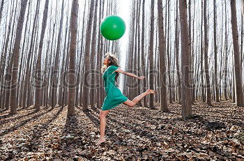 Similar – Beautiful blonde girl, dressed in green, standing in the forest