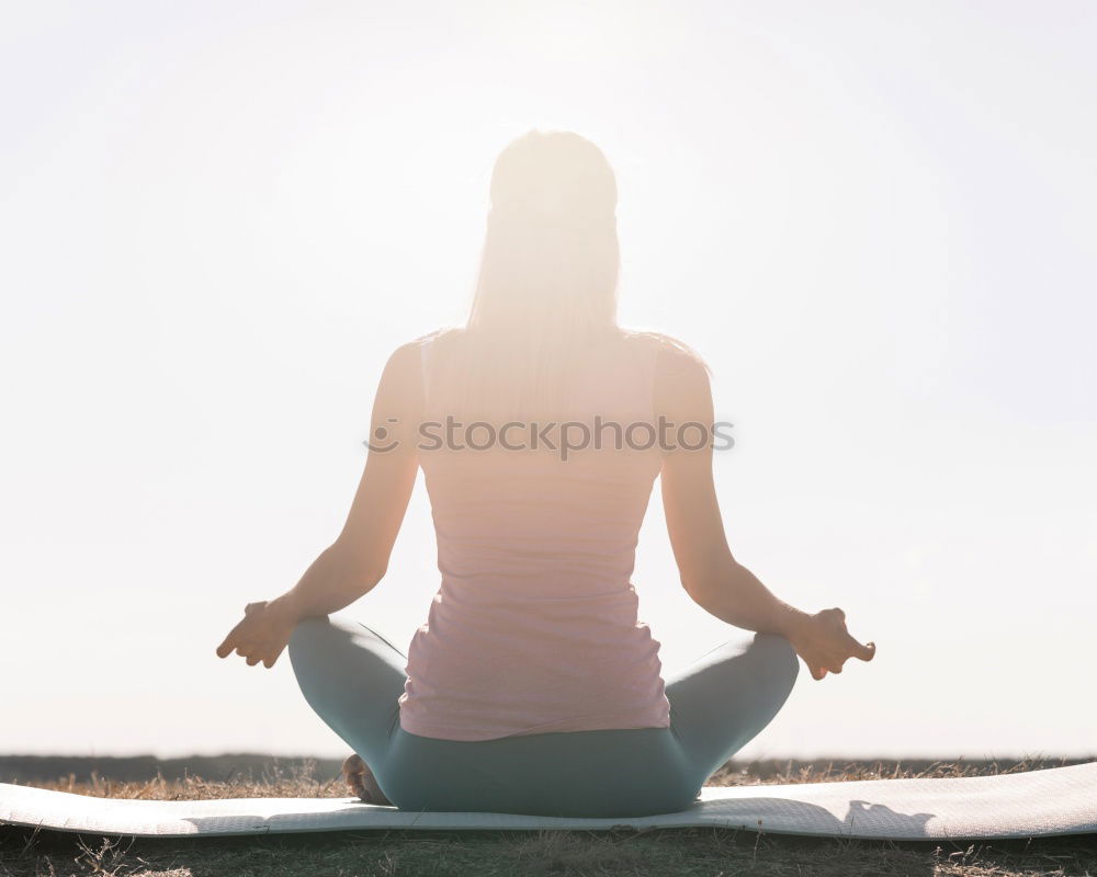 Similar – Image, Stock Photo Young woman practicing yoga by sea