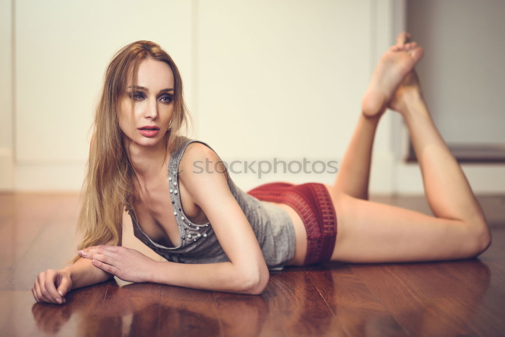 Similar – Image, Stock Photo Young adult caucasian woman in red lingerie sitting on the floor