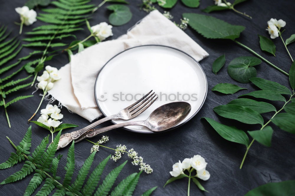 Similar – Ceramic white plate on a brown surface