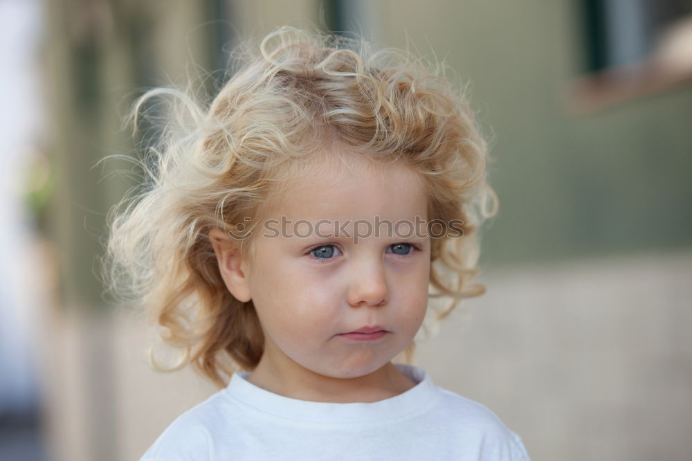 Similar – sad little girl holding toy with her hands