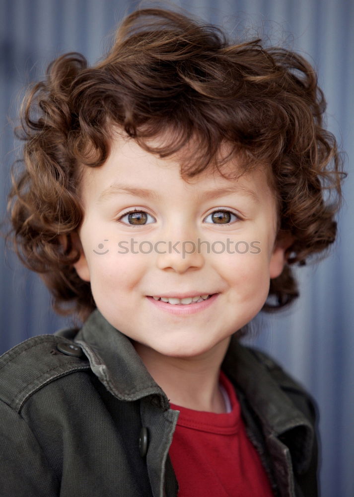 Similar – Small child with two years and curly hair looking at camera