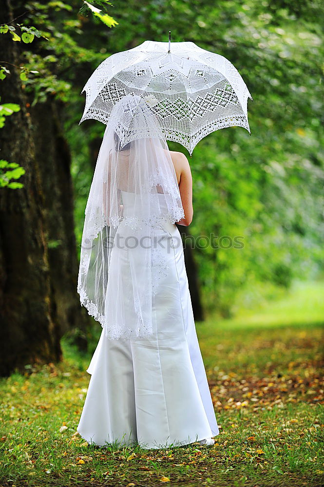 Similar – happy kid girl hiding under umbrella