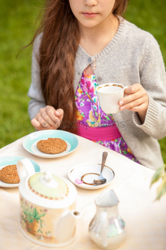 Similar – kid girl drinking hot cocoa at home in winter