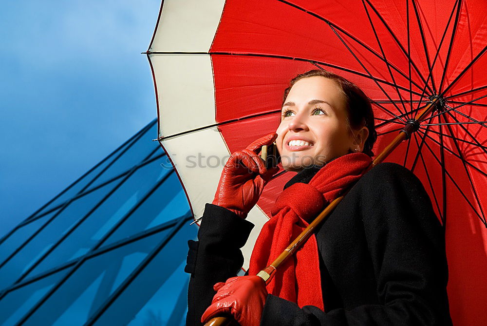 Similar – Young woman with red umbrella red nails and red lipstick