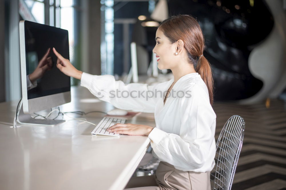 Similar – Woman in armchair using laptop and drinking coffee