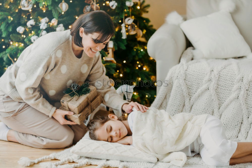 Image, Stock Photo Mother and son putting christmas costume on