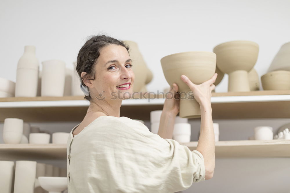 Similar – Image, Stock Photo Beautiful ceramist owner looking to the camera while smiling
