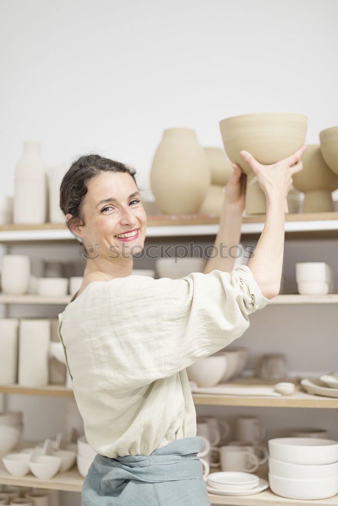 Image, Stock Photo Beautiful ceramist owner looking to the camera while smiling