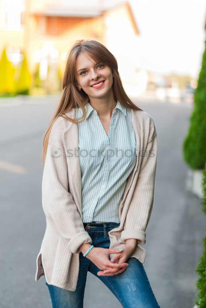 Similar – Blonde girl with red shirt enjoying life outdoors.