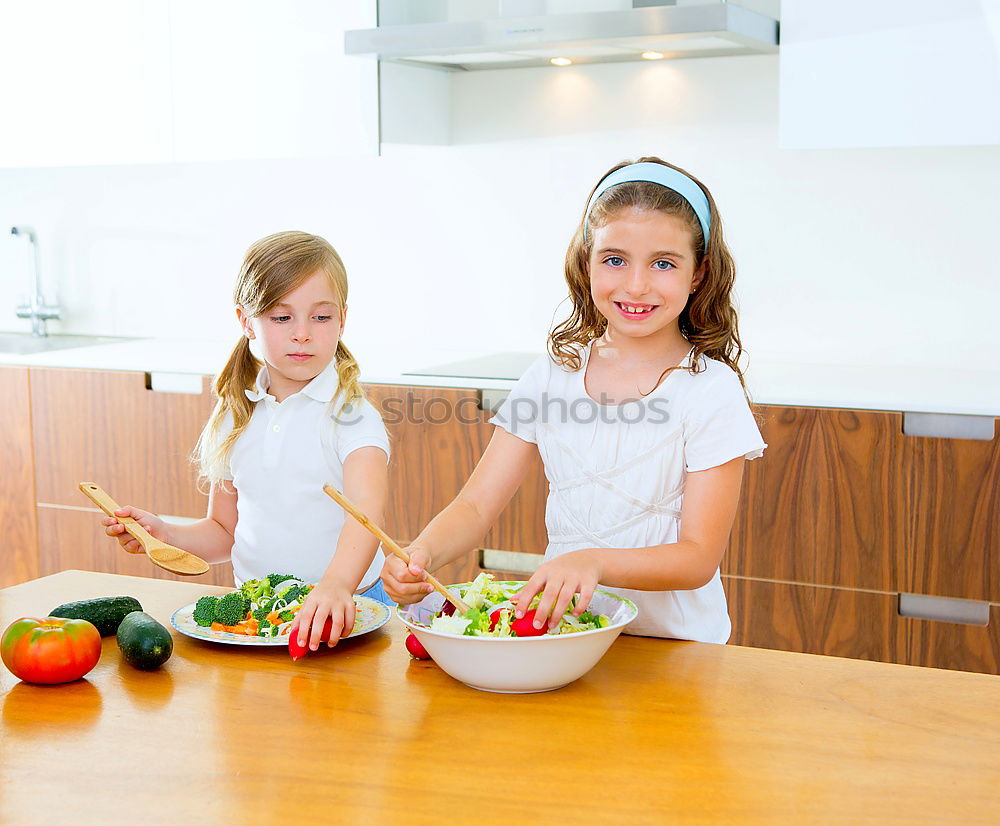 Similar – Image, Stock Photo Little sisters girl preparing baking cookies.