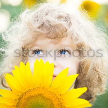 Similar – boy playing in sunflower field