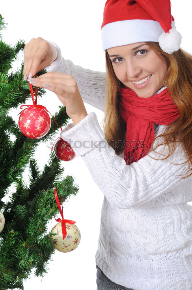 Similar – Image, Stock Photo Young girl decorating Christmas tree with lights at home