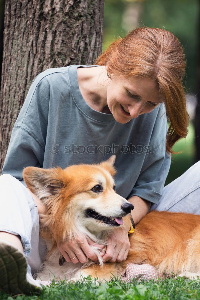 Similar – Woman with dog in the city