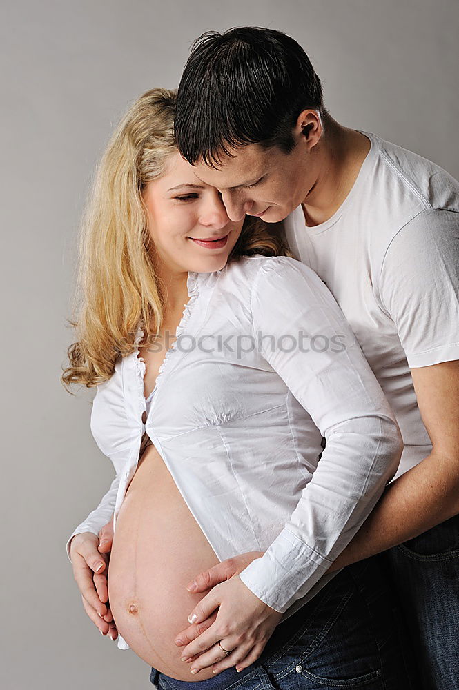 Similar – Image, Stock Photo Happy pregnant couple feeling the movements of their baby