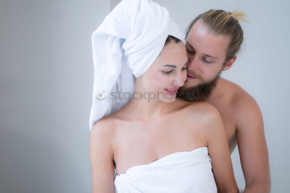 Similar – Happy couple embracing on bed