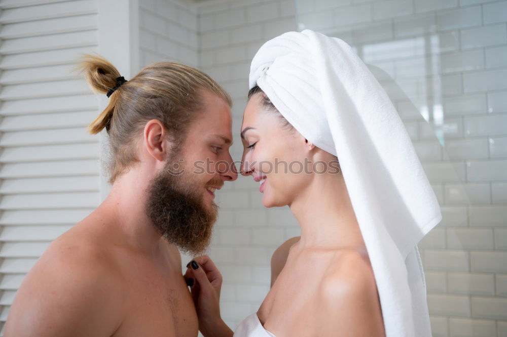 Similar – Happy couple embracing on bed