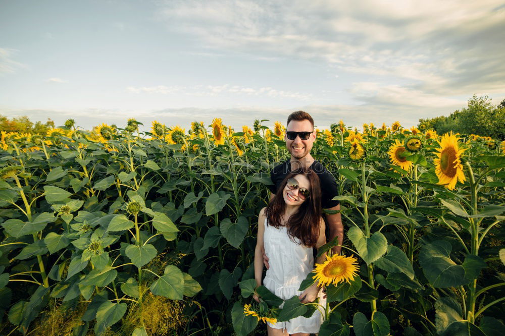 Similar – Image, Stock Photo Young adult adventerous couple hitchhiking together