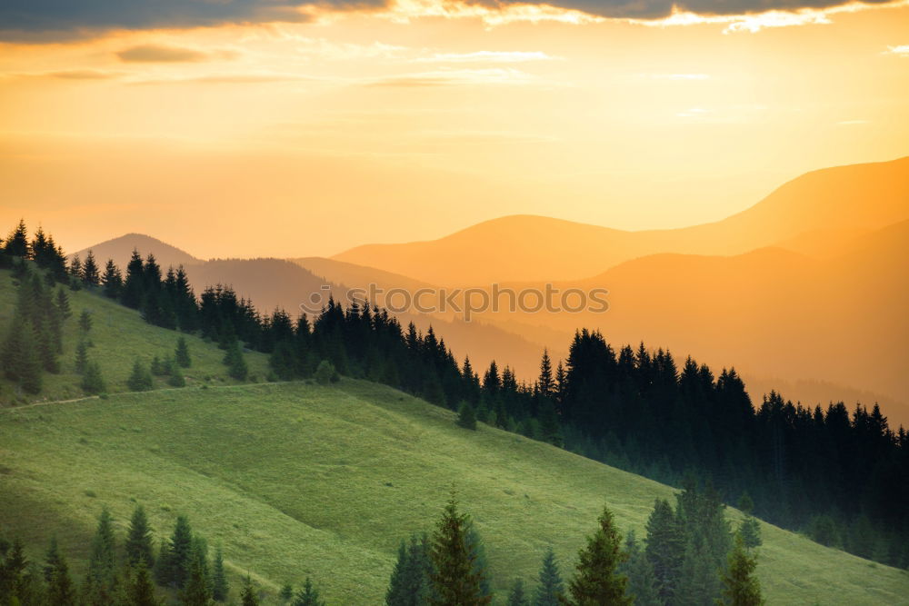 Similar – Panorama of sunset in the mountains