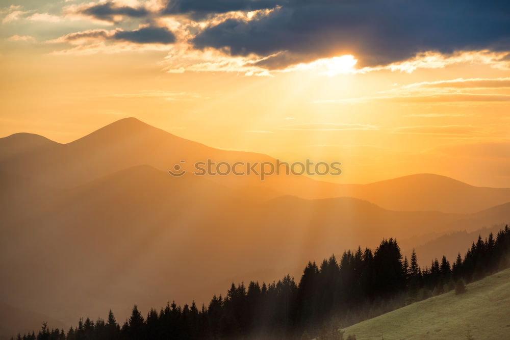 Similar – Panorama of sunset in the mountains