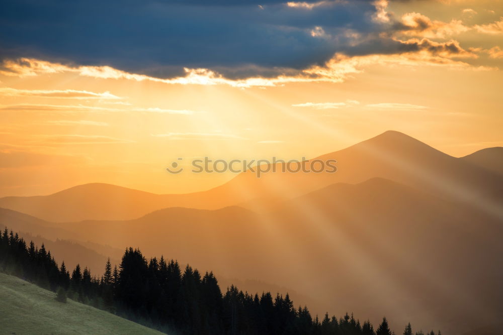 Similar – Panorama of sunset in the mountains