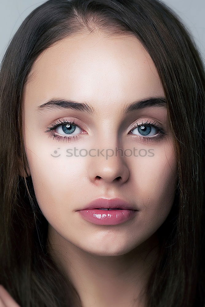 Similar – Portrait of a young teenager girl standing looking throughout the window