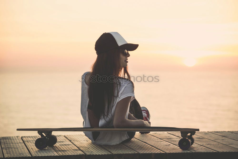 Similar – Hipster guy sitting on railing browsing with his smart phone