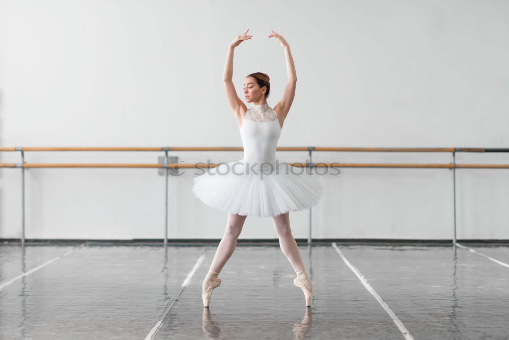 Similar – Elegante Ballerina in weißem Kleid tanzt gegen eine rustikale Wand