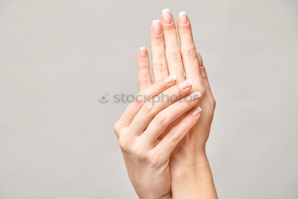 Similar – Image, Stock Photo Forearm and hand with spread fingers against a yellow background