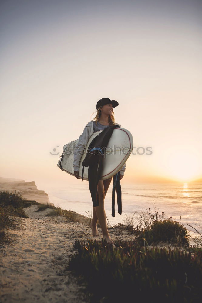 Similar – Man standing with skateboard at shore