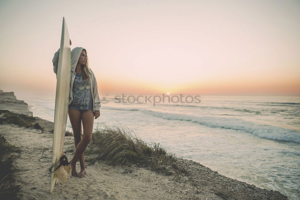 Similar – Image, Stock Photo Young Girl is sitting enjoying the view of the sunset at ocean