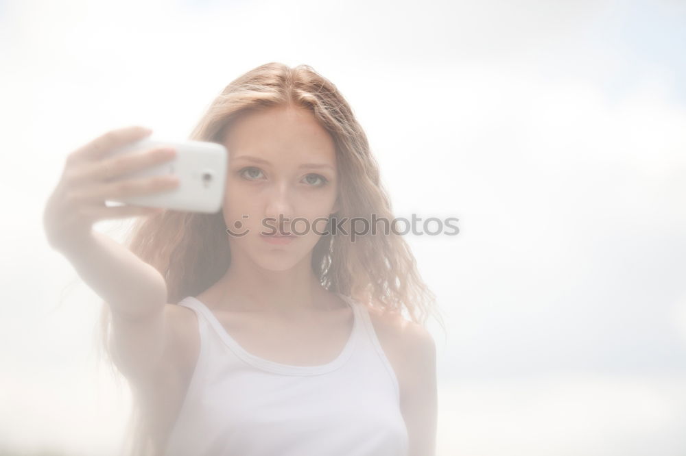 Similar – Young beautifil woman taking a selfie