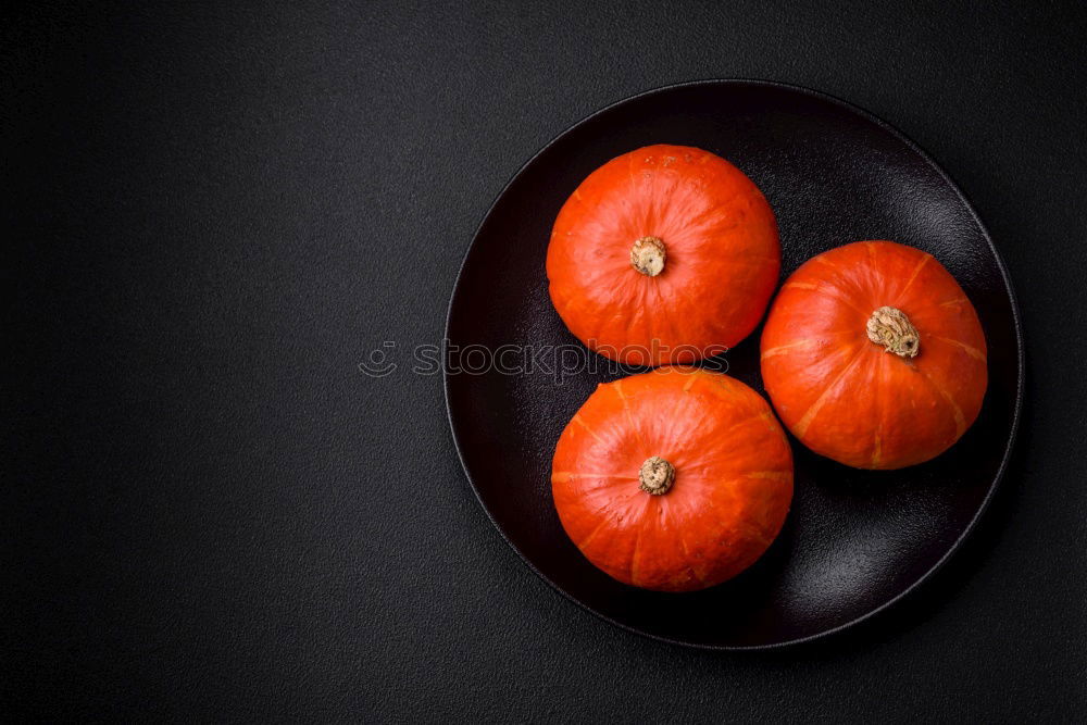 Similar – Oranges on dark background