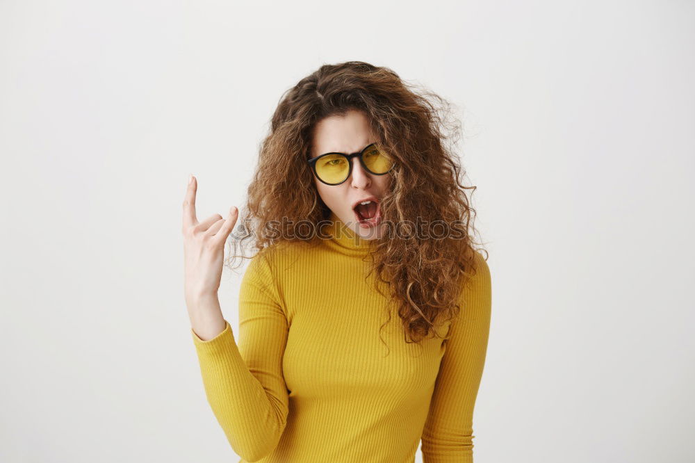 Similar – Image, Stock Photo Young redhead smiling woman in yellow hipster beanie cap pulls FFP2 mask away from face below